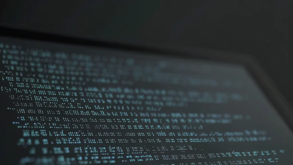 A code terminal window with lines of code on a dark screen