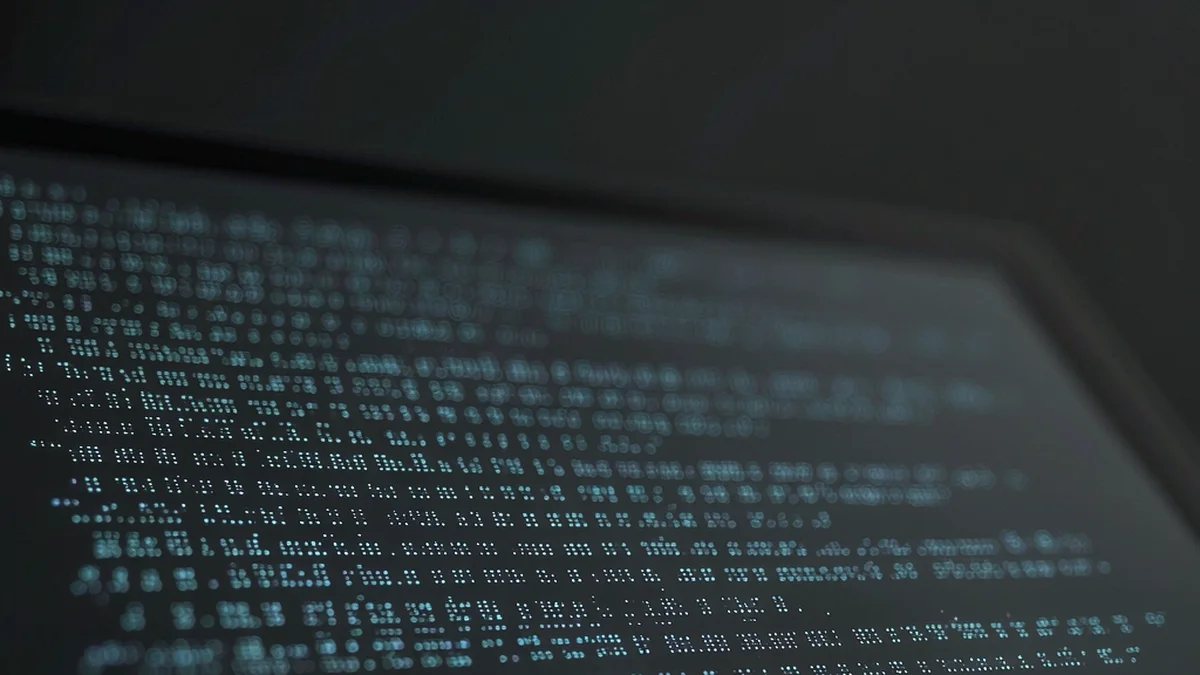 A code terminal window with lines of code on a dark screen